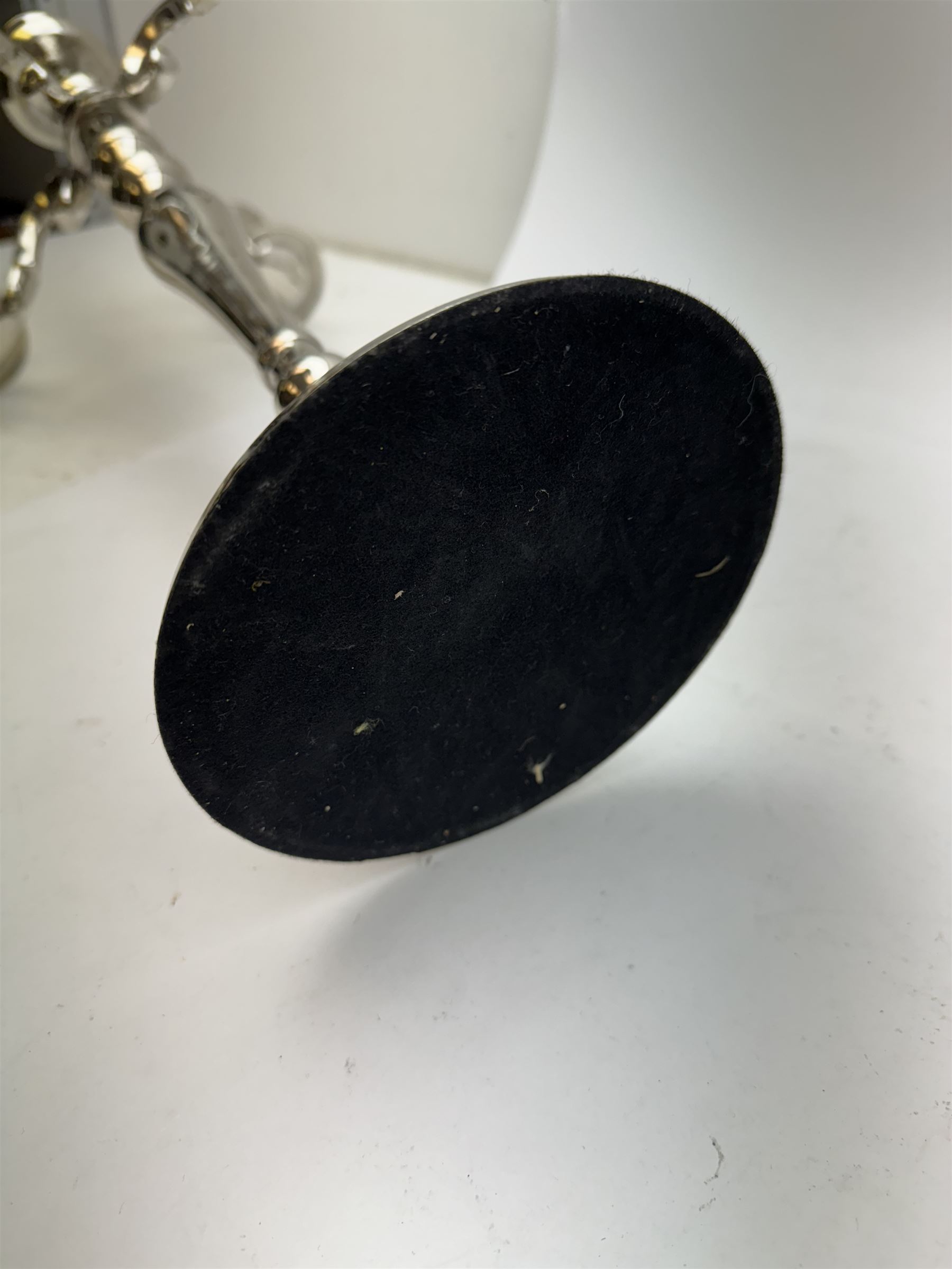 Pair of four branch candelabras, urn-shaped nozzles raised upon scroll branches supported from tapering central stem, with a stepped circular base, H59cm