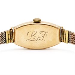 Omega early 20th century ladies 9ct rose gold manual wind wristwatch, silvered dial with Arabic hour markers, back case engraved with initials 'L.F', Edinburgh import mark 1931, on tri-coloured gold bracelet, with adjustable clasp, stamped 9ct
