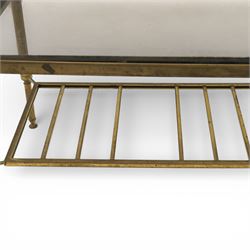 20th century brass and glass topped coffee table, the rectangular glass top within brass frame, upon four reeded legs united by lower slatted under tier 