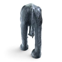 In the style of Liberty & Co - pair of 20th century ebonised leather elephants