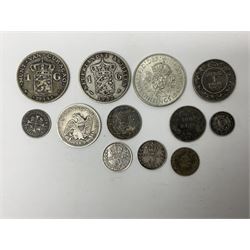 Twelve World coins, including William IIII United Colony of Demerary and Essequibo 1832 one eight guilder, United States of America 1857 quarter dollar, Tunisia 1891 one franc etc 