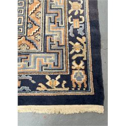 Chinese hand knotted wool carpet, first half of the 20th century, the blue field decorated with  auspicious symbols and floral motifs within multiple borders. 490cm x 363cm.  - COLLECTION BY APPOINTMENT FROM: The White House, Thirsk Road, Easingwold, York, YO61 3NF - CALL 01723 507111 TO ARRANGE