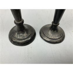 Two early 20th century silver trumpet vases to include a Martin Hall & Co Ltd example, silver circular box raised on three feet stamped Birmingham 1912, ashtray hallmarked London 1945, silver backed hair brush with engine turned decoration etc, tallest H19.5cm