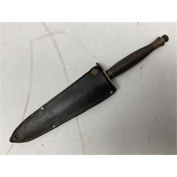 Fairburn and Sykes Commando fighting knife, 3rd pattern with 17cm double edged blade and copperised grip; no markings; in cut-down plain leather sheath L31.5cm