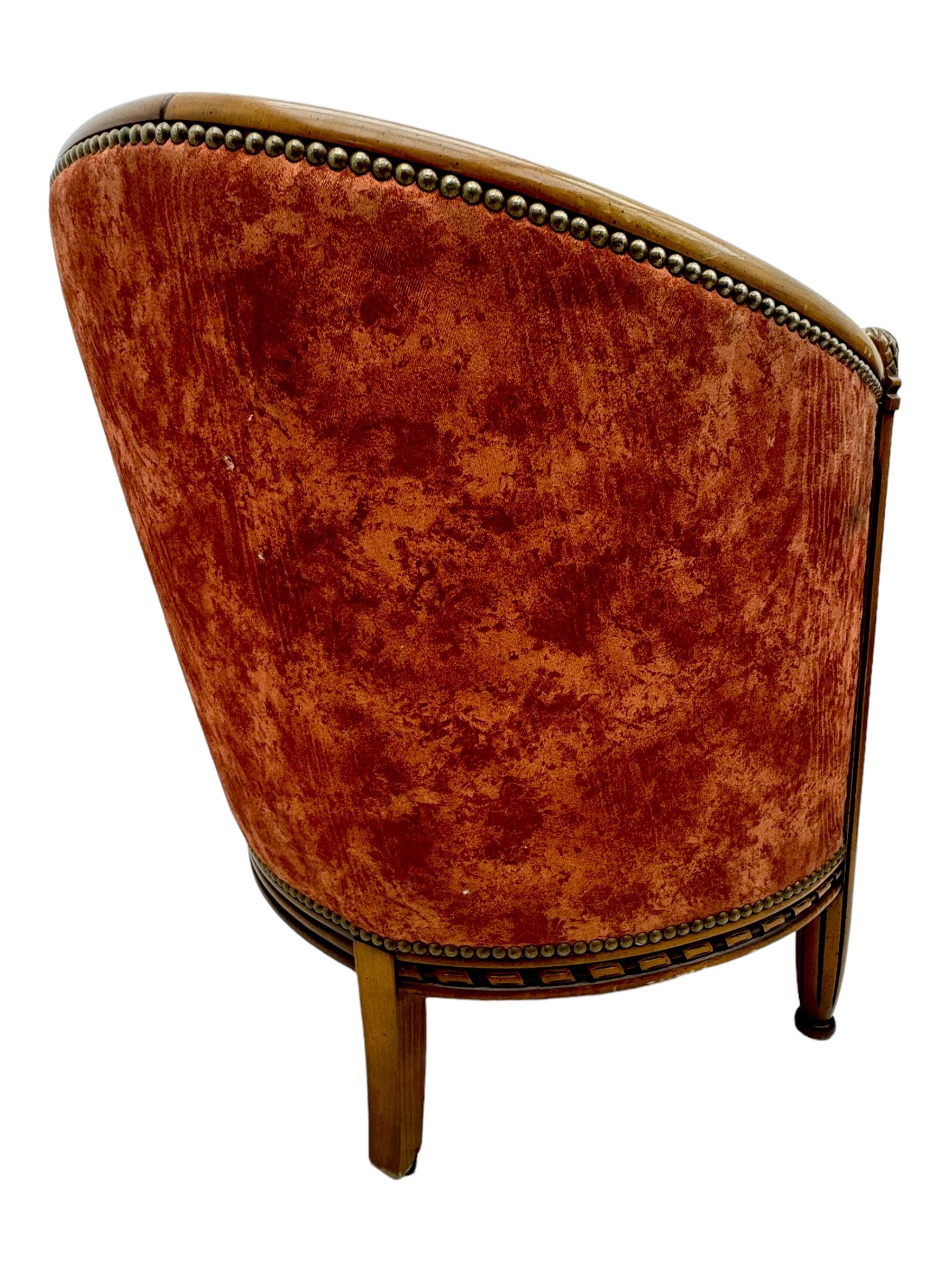 Pair of cherry wood framed tub-shaped armchairs, upholstered in striped floral fabric with brass stud trim, carved walnut frame with fluted supports capped with pinecone finials, on turned feet
