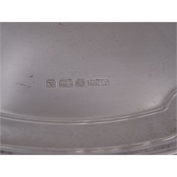 Modern silver salver, with shaped pie crust rim, upon four scroll feet, hallmarked L R Watson, Sheffield 1997, D21cm