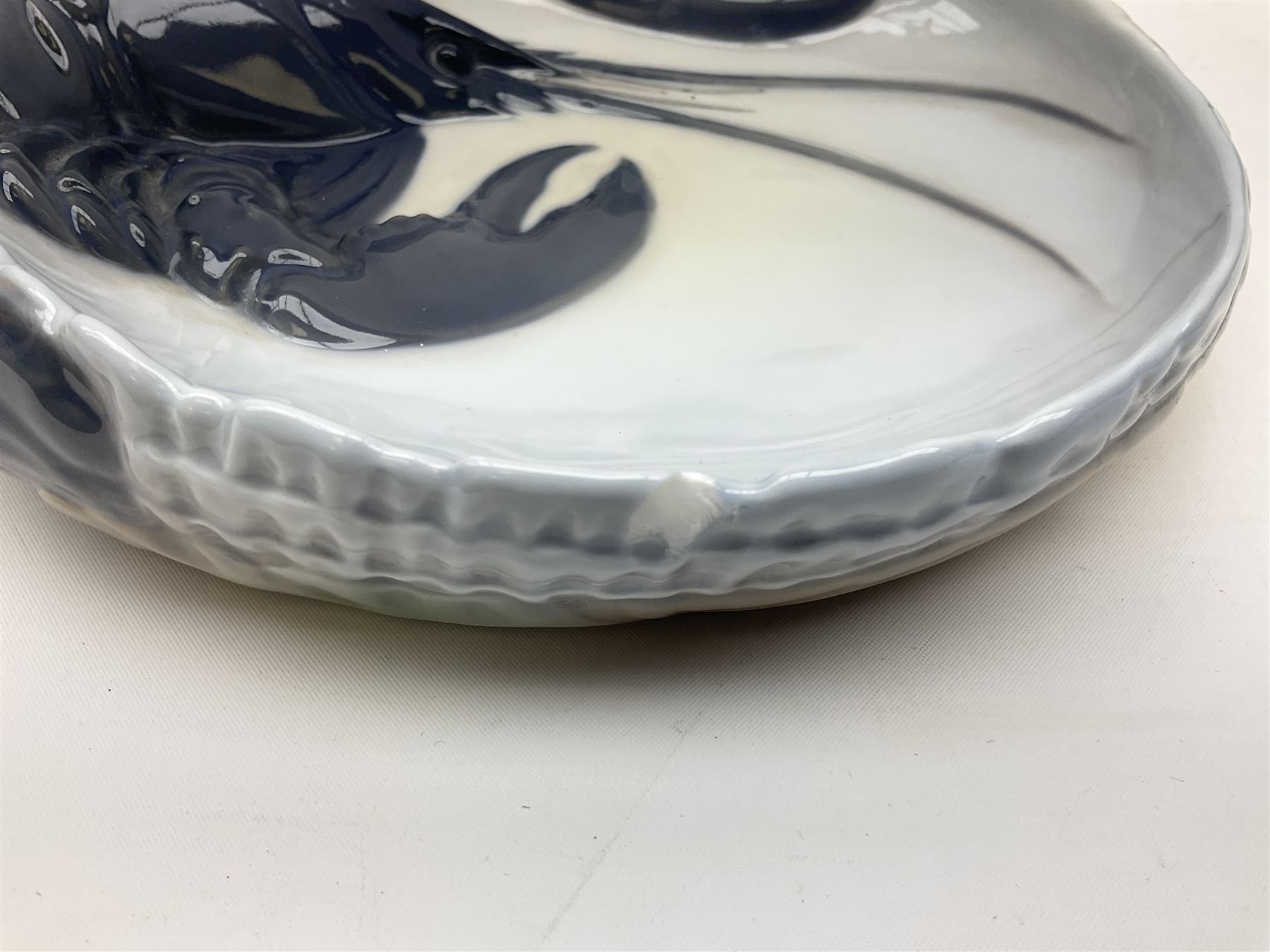 Pair of Royal Copenhagen bowls modelled as baskets and mounted with lobsters, model no 3498 and 3277, with painted and printed marks beneath, largest D19cm