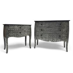 Contemporary black lacquered metal-clad chest, embossed with silver floral scrollwork, shaped rectangular top over three drawers, on cabriole supports (W89cm, D40cm, H79cm); matching two drawer chest (W68cm, D35cm, H67cm)