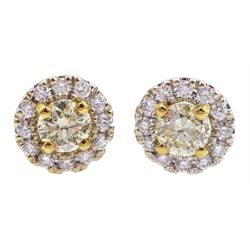 Pair of 18ct gold white and yellow diamond cluster stud earrings, total diamond weight 0.64 carat, with World Gemological Report