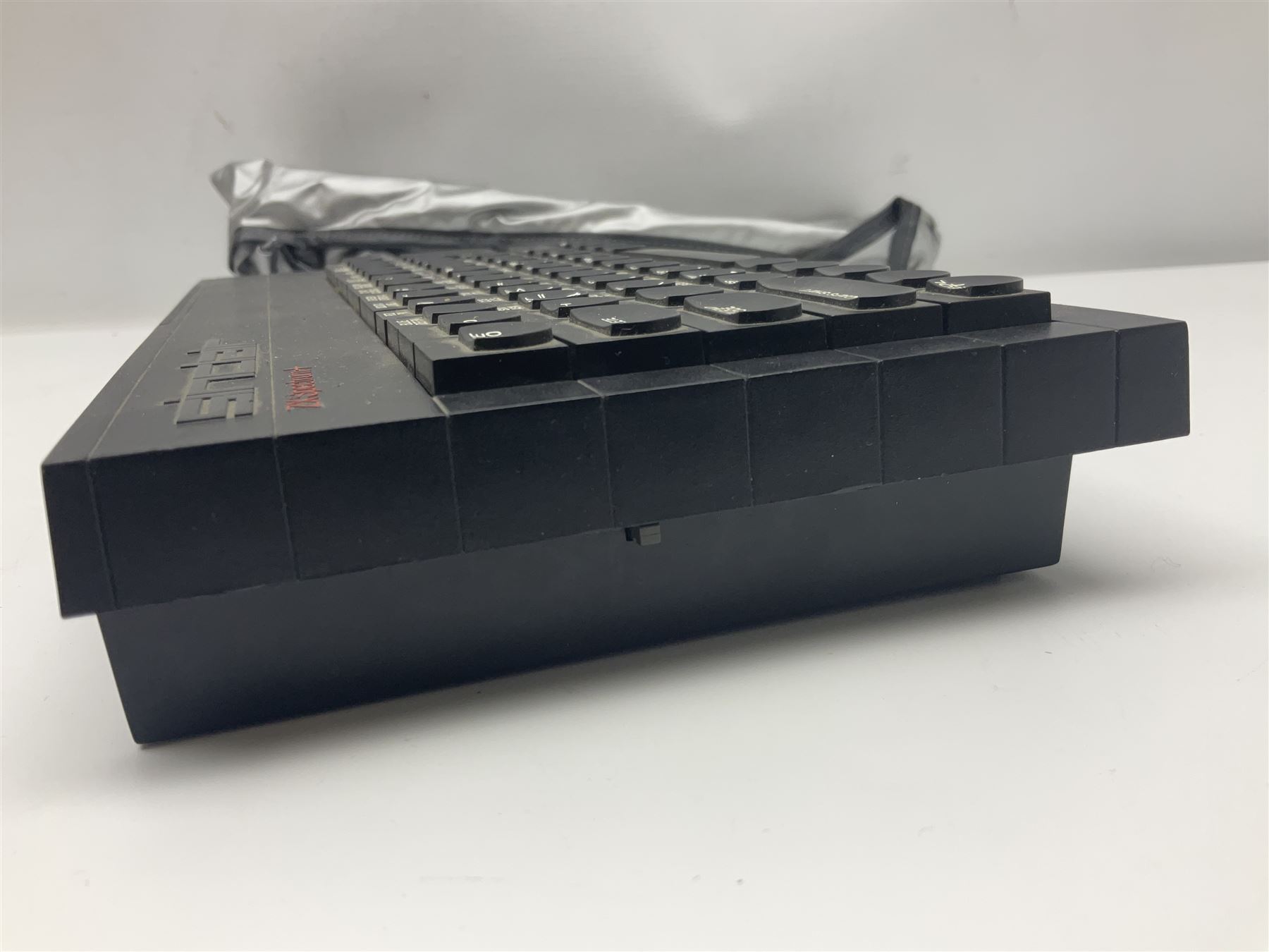 Sinclair ZX Spectrum (1984) with accessories and games; ten games for Sinclair Spectrum and 48K Spectrum to include ‘Knight Lore’, ‘The Way of the Exploding Fist’, and ‘Green Beret’ all in original boxes, ‘Rambo First Blood Part II’ without original box; Sinclair UK1400 Power Supply Unit, Hales Universal Mains Adapter, RAM Turbo Spectrum Joystick Interface, Starlite Cassette Player, all without boxes