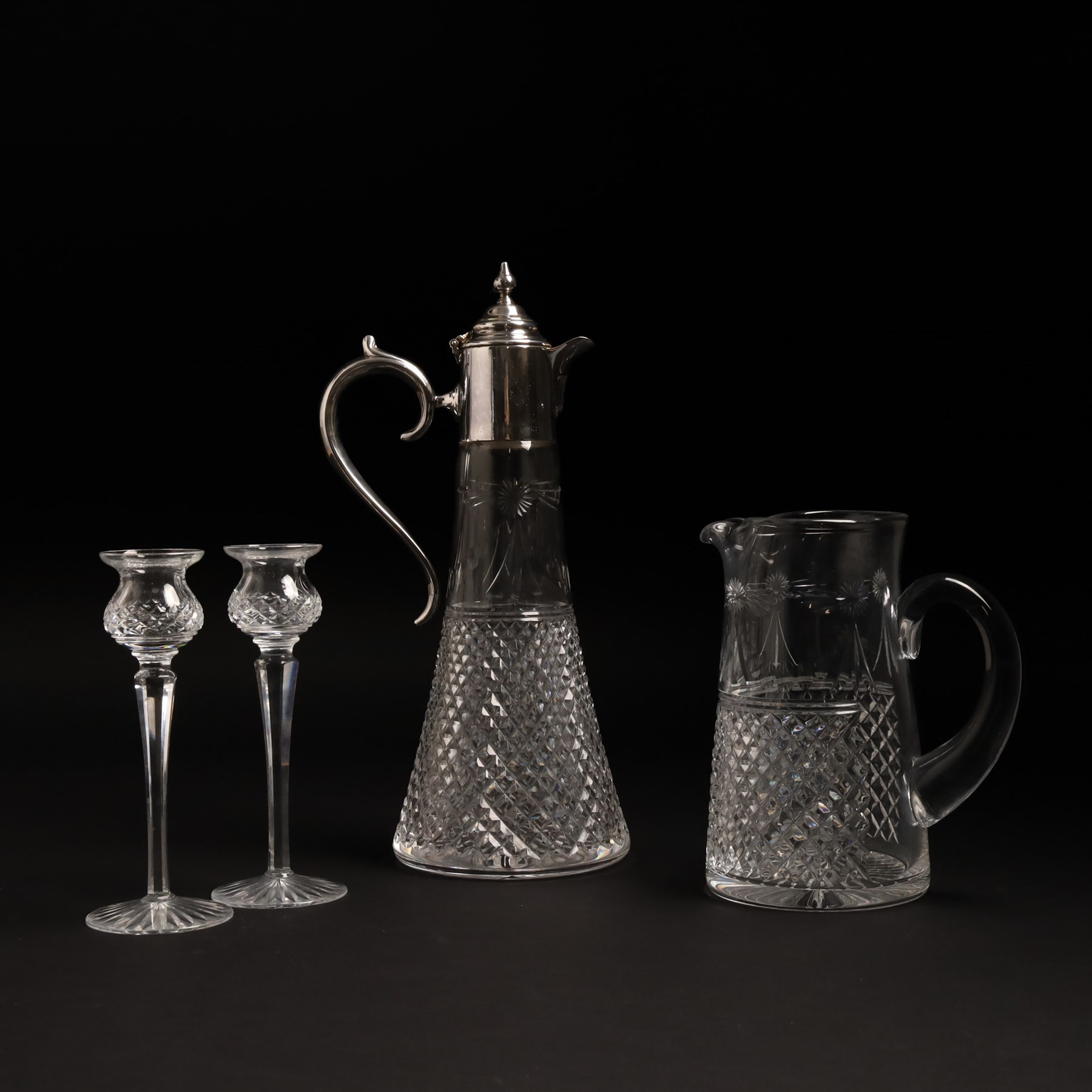 Stuart crystal Beaconsfield pattern claret jug with silver plated cover, matching water jug and pair of candlesticks