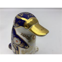 Three Royal Crown Derby paperweights, comprising Puffin with gold stopper and original box, Platypus with silver stopper and Penguin with missing stopper, all with printed marks beneath 