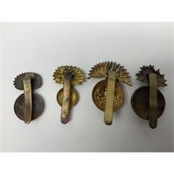 Nineteen Yeomanry metal cap badges including Derbyshire, Northamptonshire, Essex, Glamorgan, Staffordshire, City of London, Surrey, Shropshire, Hertfordshire etc; together with eleven Fusiliers badges including Lancashire, Royal Welch, Northumberland etc (30)