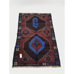 Baluchi red and blue ground rug, two medallions, 130cm x 83cm