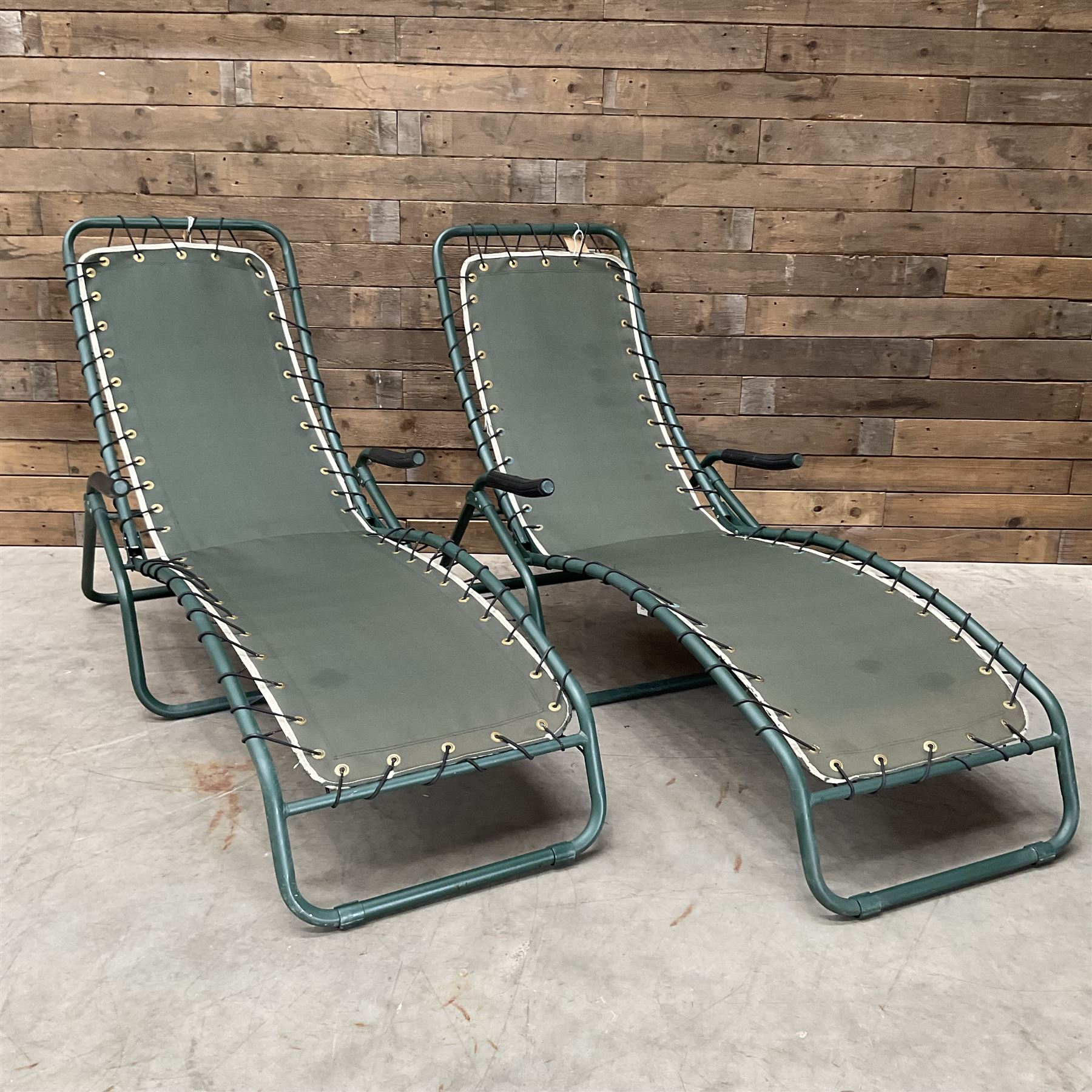 Pair metal framed folding sun loungers