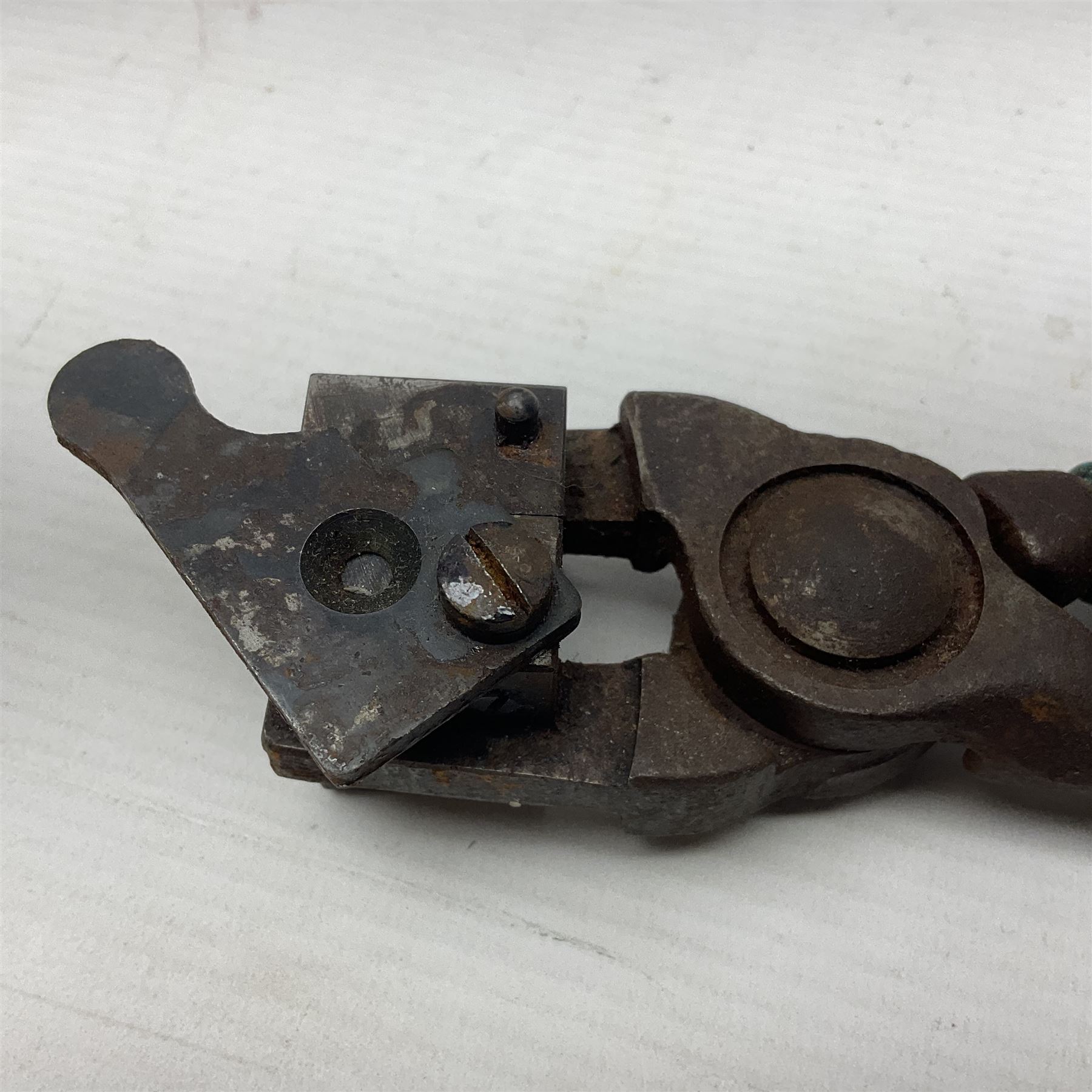 Two leather shot flasks with embossed decoration and brass nozzles; scissor action bullet mould with two ladles; pair of 19th century J.B. Warrilow hammer actions; small quantity of Staybrite buttons; and 1968 dated metal ammunition tin for 200 x 7.62 blank cartridges