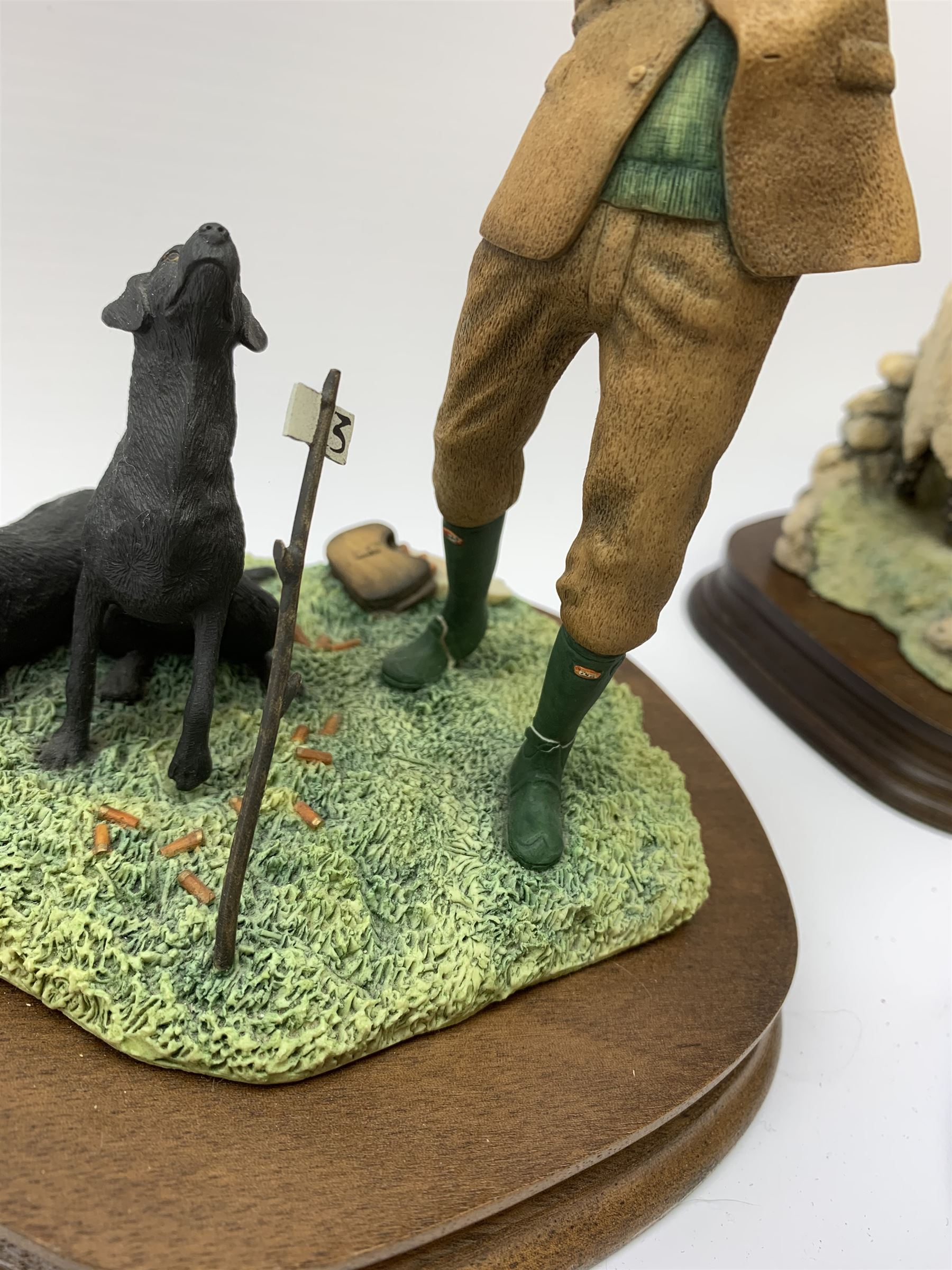 Three Border Fine Arts models, Spring Lambing, model no JH6, by Ray Ayres, King of the Castle, model no JH37, by David Walton, and Reaching for the high bird, with black Labradors, by Ray Ayres, each upon wooden base