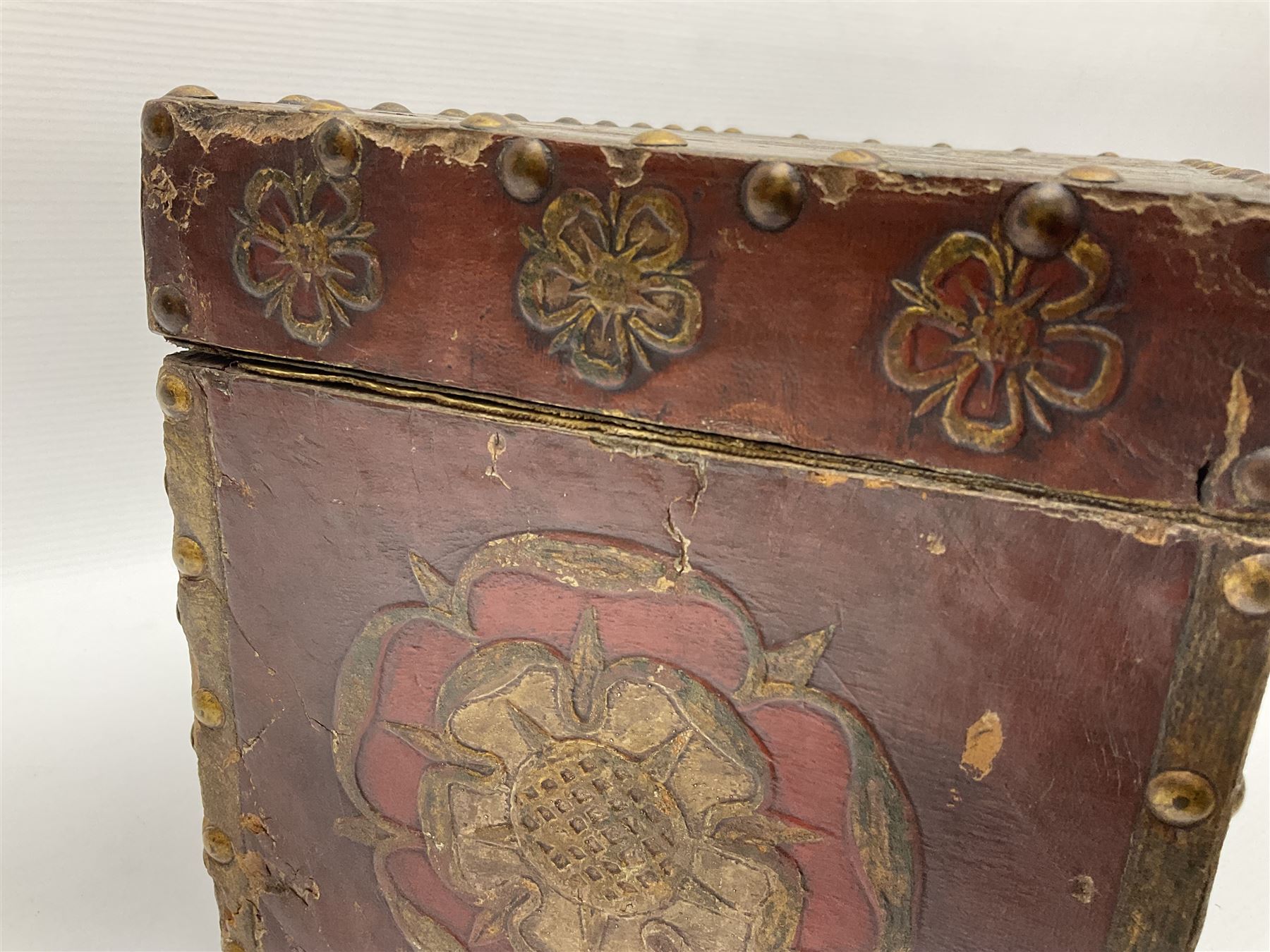 20th century box, decorated in faux leather with the royal coat of arms and GR 1719 to hinged cover, with fleur-de-lis, lion, crown and rose motifs throughout and studs to all edges, opening to reveal a purple velvet interior containing three removable wooden trays, H18.5cm
