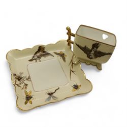 Three Pirkenhammer cups and saucers, two decorated with gilt birds in foliage on an ivory ground, the other with butterflies and foliate sprigs together with three  continental cups and saucers decorated with silver overlay 