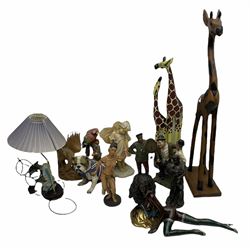 Quantity of figures to include composite and hardwood examples, to include lamp modelled  with dolphins, Laurel and Hardy figure, giraffes etc
