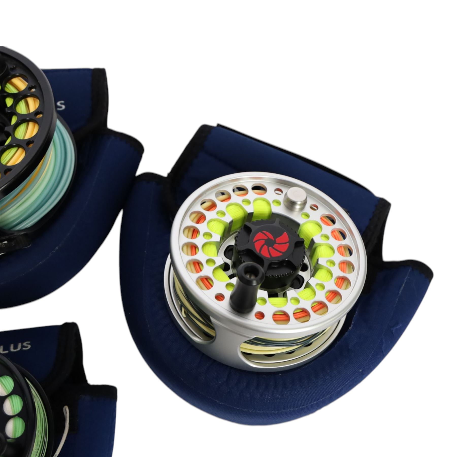 Four Nautilus USA fly reels, comprising T12, no. five and two no. ten models, all within Nautilus pouches