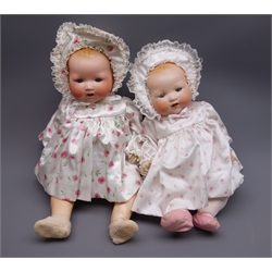  Two Armand Marseille 'My Dream Baby' bisque head dolls, each with moulded hair, sleeping eyes, open mouth with teeth and composition body with jointed limbs, one marked 'AM Germany 351/71/2K' and one marked 'AM Germany 351/8K', largest H57cm (2)  