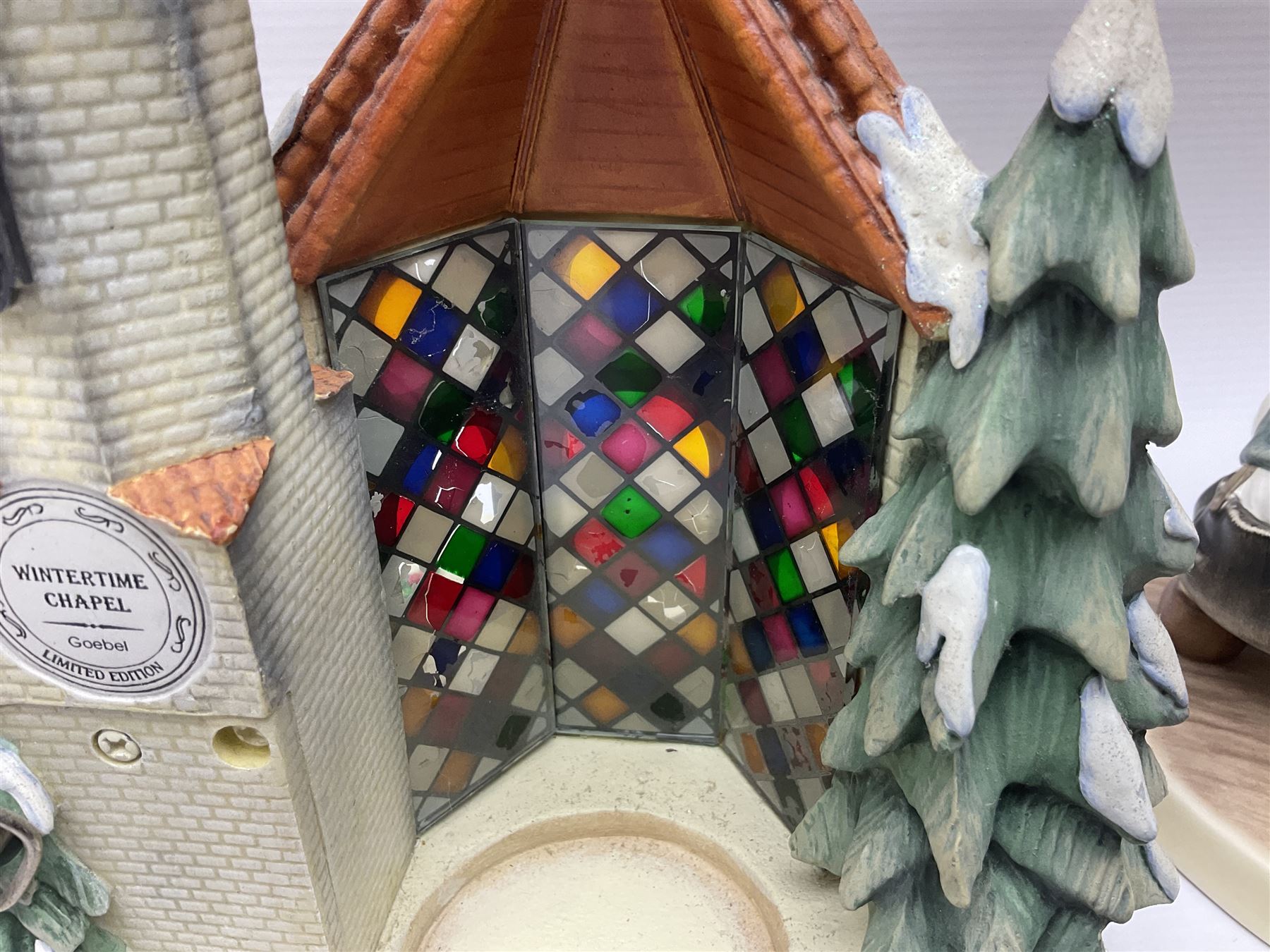 Eight Christmas Hummel figures by Goebel, to include Wintertime Chapel candle holder, Winter Fun, Christmas Morning, Christmas Time and Gingerbread Lane, tallest H21cm