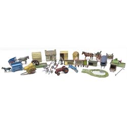 Lead figures and die-cast farm accessories including F.G. Taylor thatched cottage and rabbit hutch with rabbits; Hill & Co pig sties; haystacks; various horse drawn vehicles; two caravans; tractor; hay rake; mirrored pond; water-wheel etc