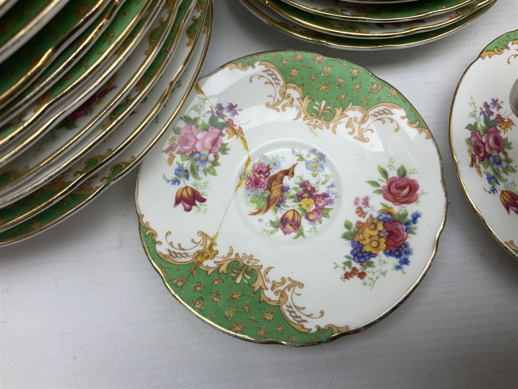 Paragon Rockingham pattern part tea and dinner service including three teapots, milk jug, cups and saucers of various sizes, ten soup bowls, ten side plates, ten dinner plates etc (96)