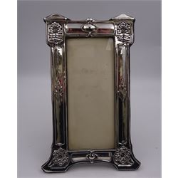 Art Nouveau silver mounted photograph frame, of rectangular form, with repousse decorated columns of floral and foliate detail, with easel style support verso, hallmarked J Aitkin & Son, Birmingham 1907