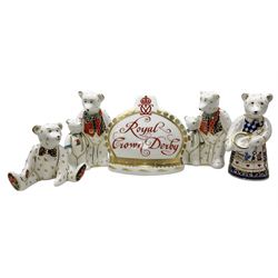 Four Royal Crown Derby teddy paperweights, comprising Teddy Cook, two Teddy George and Seated Teddy, all without stoppers, together with Crown Namestake with gold stopper 