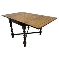 Early 20th century oak barley twist extending table, two fold-over leaves with pull-out stays, spiral turned supports joined by x-stretchers