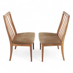 G Plan - mid-20th century teak extending dining table, oval top with integrated extension leaf, raised on tapering legs, together with a set of six slat back dining chairs including two carvers, upholstered in dark green velour (Extends to 210cm)