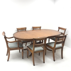 Regency style yew wood twin pedestal extending dining table, single leaf, brass capped hairy paw feet (W186cm, H77cm, D108cm) and set six (4+2) chairs, pierced splat, upholstered seat, turned supports (W53cm)