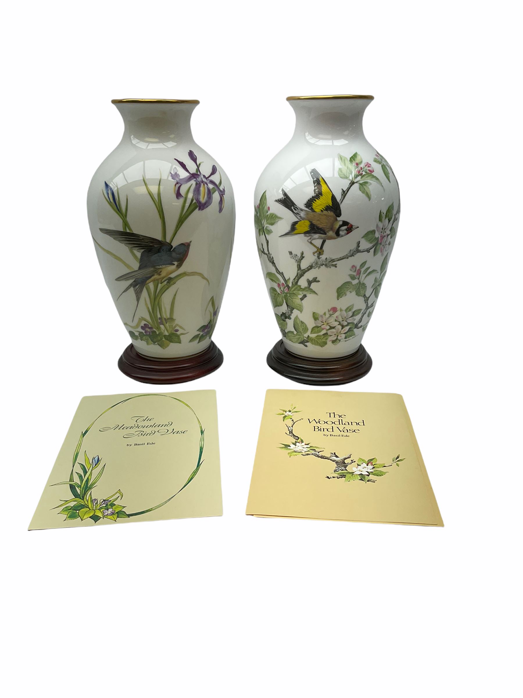 Pair of Franklin Porcelain ovoid vases, The Meadowland Bird Vase and The Woodland Bird Vase by Basile Ede H30cm, with wooden stands and certificates.