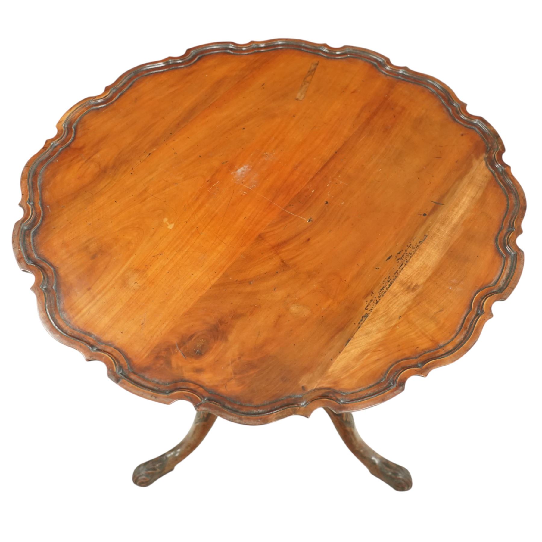 Georgian mahogany pie crust occasional table, the circular dished top with scalloped and moulded edge, raised on a turned pedestal with three cabriole supports terminating in pad feet