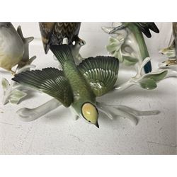 Seven Karl Ens bird figures, including barn owl, eagle owl, blue tit, budgerigar etc, all with mark beneath, tallest H17cm 