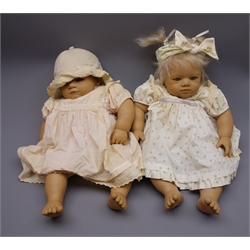  Two Annette Himstedt vinyl baby dolls - 1990/91 'Taki' with brunette hair, brown eyes, closed mouth, velveteen cloth body and vinyl lower limbs, and 1990/91 'Annchen' with blonde hair and blue eyes, both H55cm (2)  