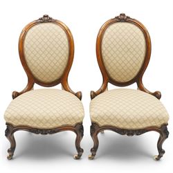 Pair of Victorian walnut framed ladies salon nursing chairs, oval cameo back with carved c...