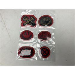 Large quantity of military embroidered cloth badges including shoulder sliders and titles, blazer badges, arm badges, rank pips and trade badges etc
