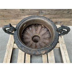 Victorian design ornate cast iron centrepiece urn, featuring two handles, raised on footed base