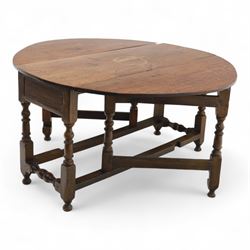 Early 19th century oak drop-leaf gateleg table, oval top above plain frieze, on ring turned legs joined by stretchers