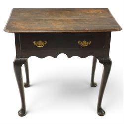 18th century oak lowboy, the rectangular top with moulded edge and eared front-corners, fitted with single drawer with pressed brass handle-plates, shaped apron over cabriole supports and pad feet