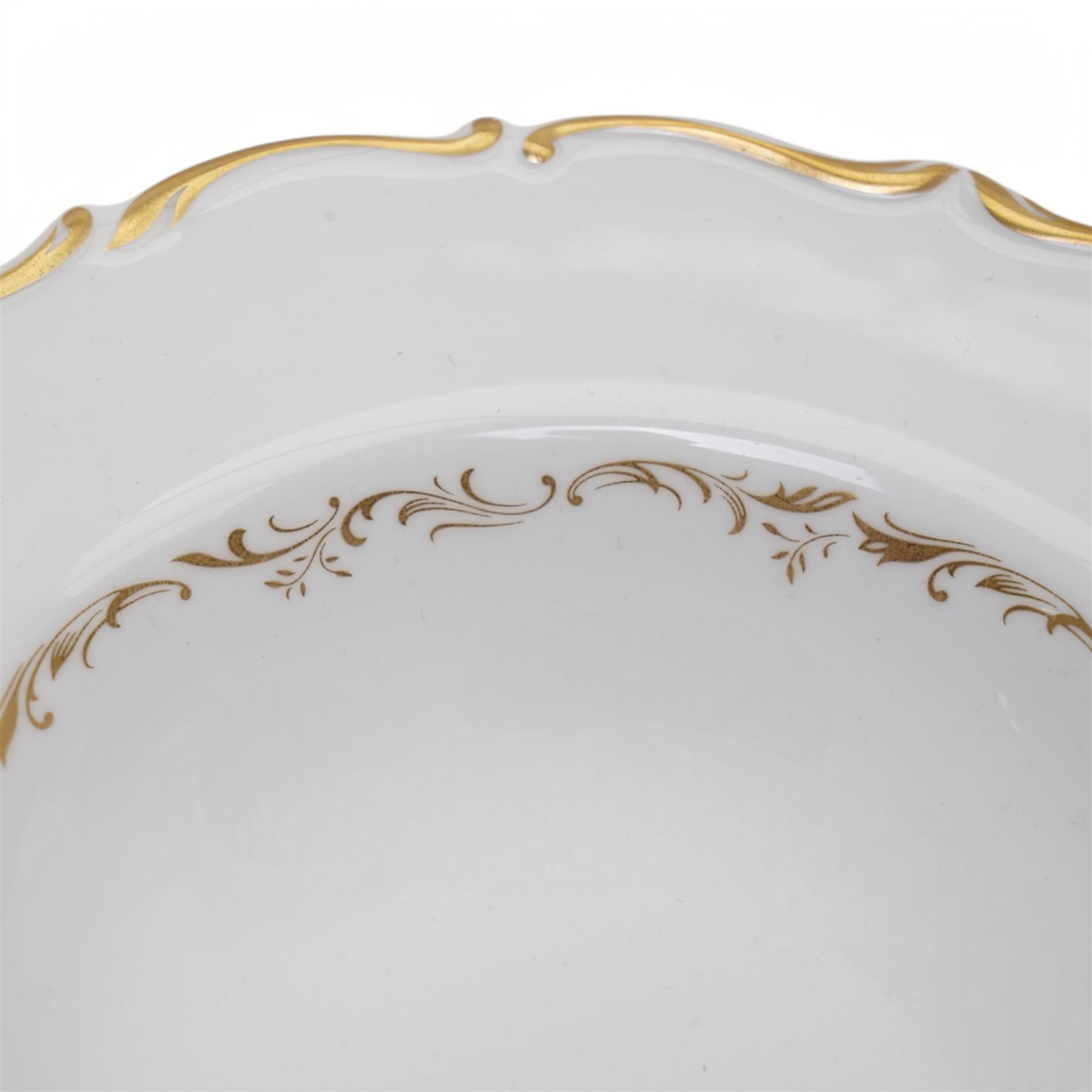 Royal Doulton dinner service in the 'Richelieu' pattern, comprising eleven dinner plates, twenty one dessert plates, twelve soup bowls, eleven dessert bowls, four vegetable dishes, oval serving dishes and graduating meat plates 