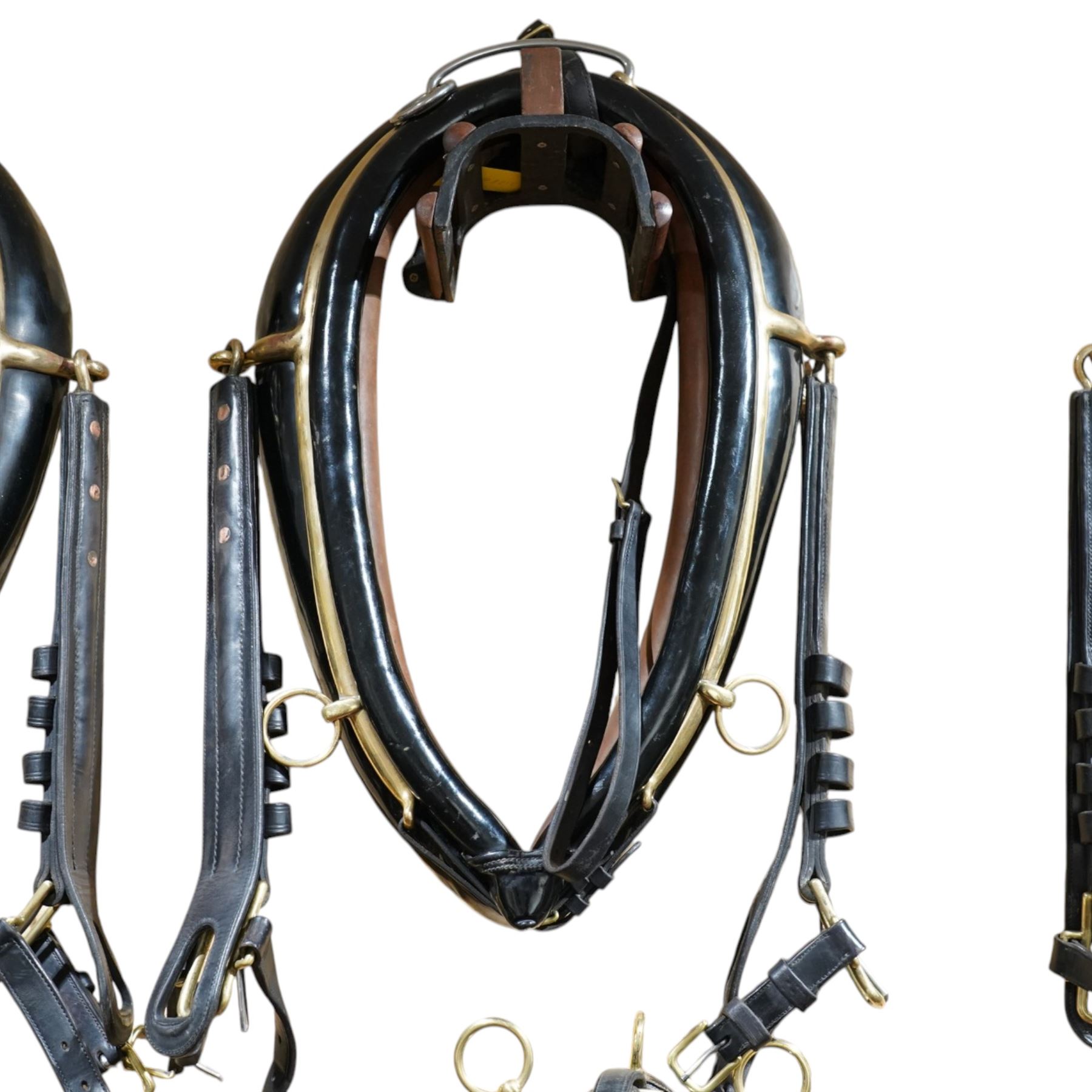 John McDonald - team set of black leather and brass harness, including four black patent leather collars (24