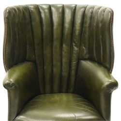 Georgian design green leather barrel-back wingback armchair, pleated upholstered back with shaped wings over scroll arms and sprung-seat, close nailed border, raised on cabriole supports terminating in pad feet