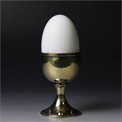 Late 20th century silver-gilt novelty surprise egg by Anthony Gordon Elson, the egg cup co...