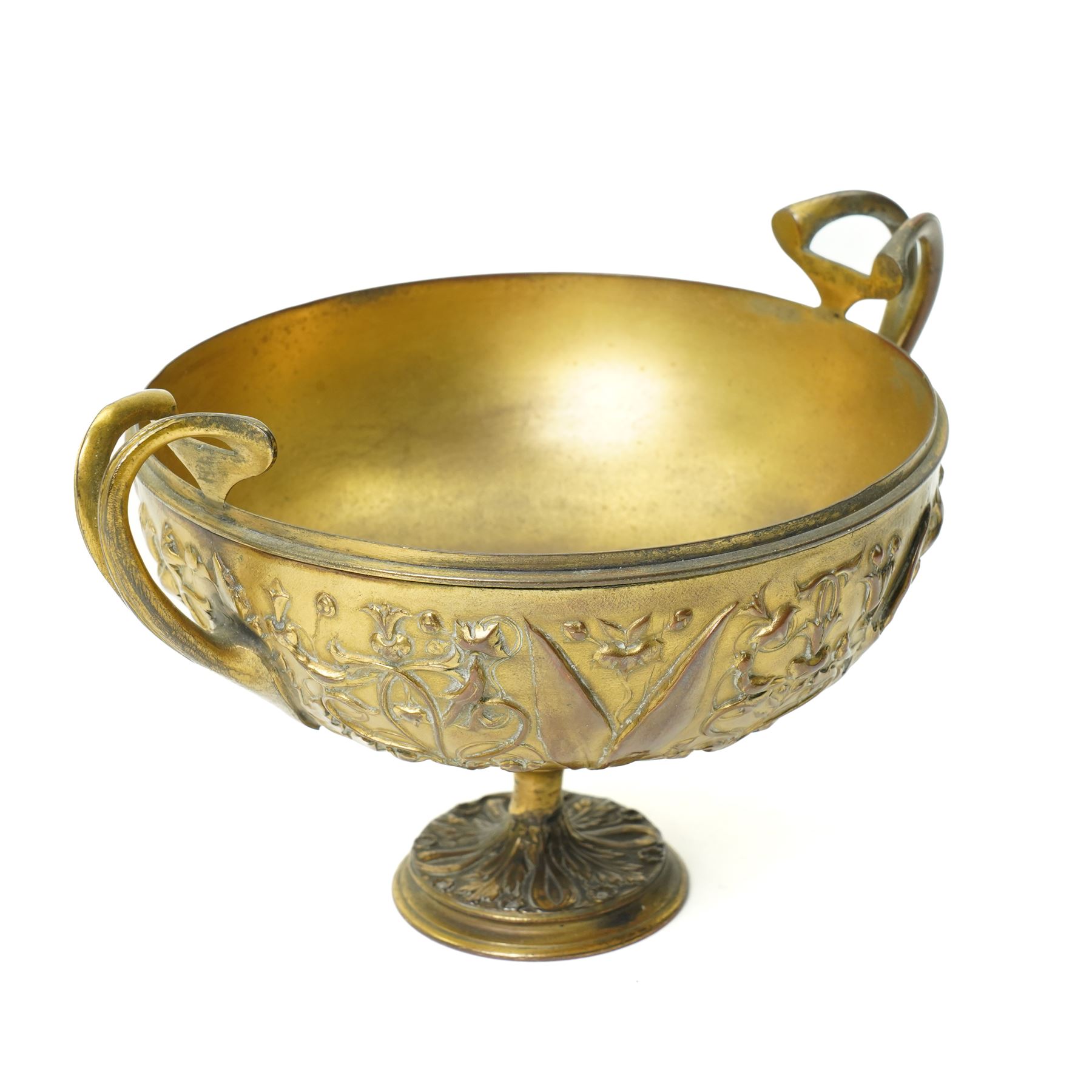 Christofle 'Tresor d'Hildesheim' facsimile gilt metal two handled cup decorated with masks, leaves etc H13cm and a bowl from the same collection with two handles and a raised pattern of leaves on a pedestal foot D19cm (2) 