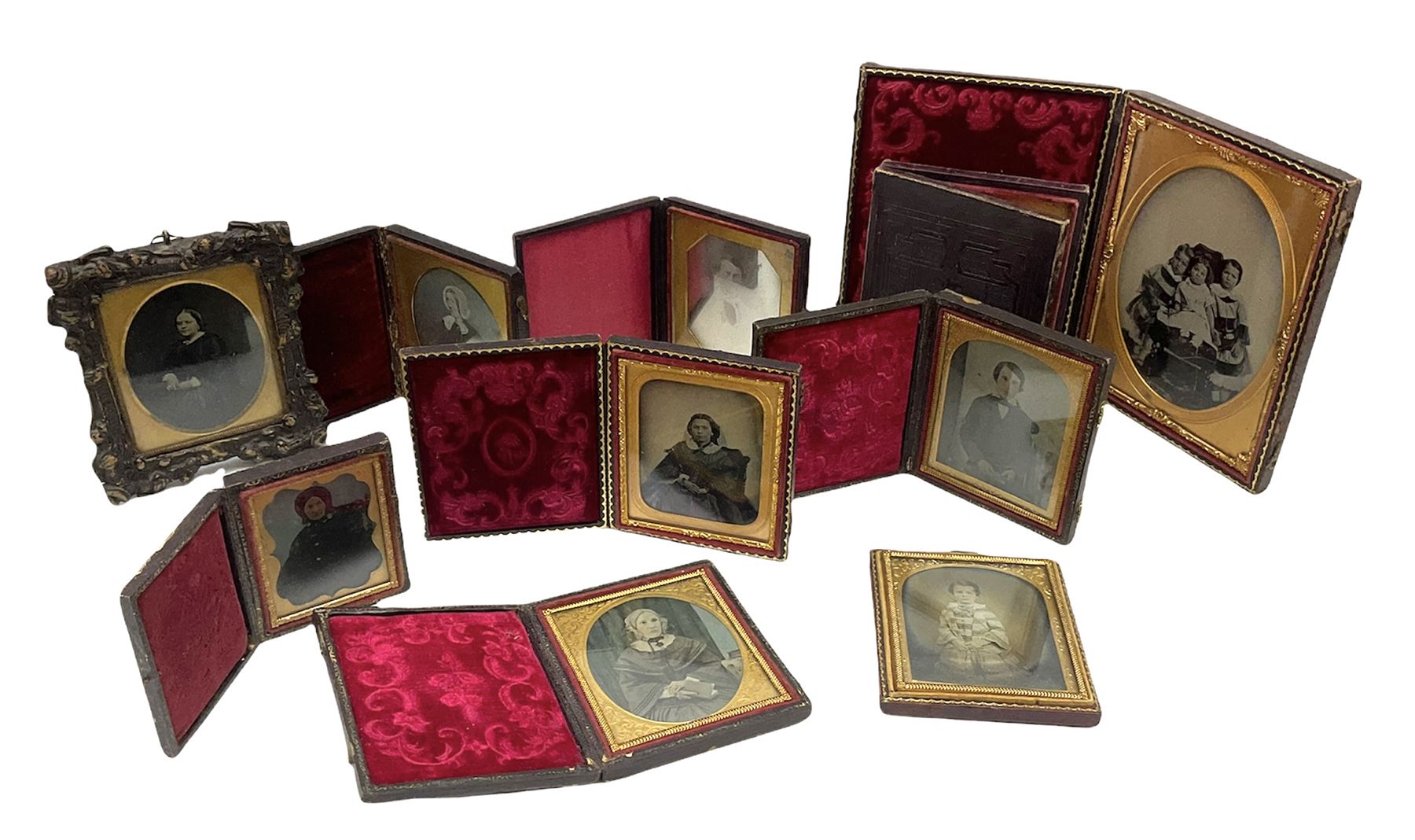 Collection of ten assorted Victorian daguerreotype, ambrotype and tintype portraits, most contained within leather cases with embossed red velvet or red silk lining, largest example with scrolling foliate embossed exterior H15cm when closed W12cm