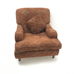 Howard style armchair upholstered in an terracotta fabric, W89cm